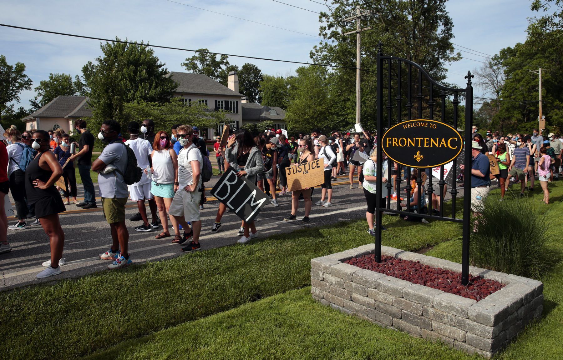 Youth march moves through wealthy suburbs